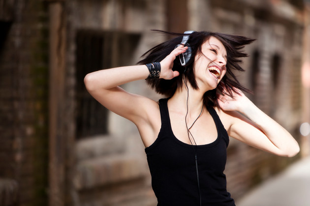 Young beautiful girl happy and dancing